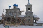 Putting up crosses on the domes of the Church of the Nativity of the Holy Mother of God